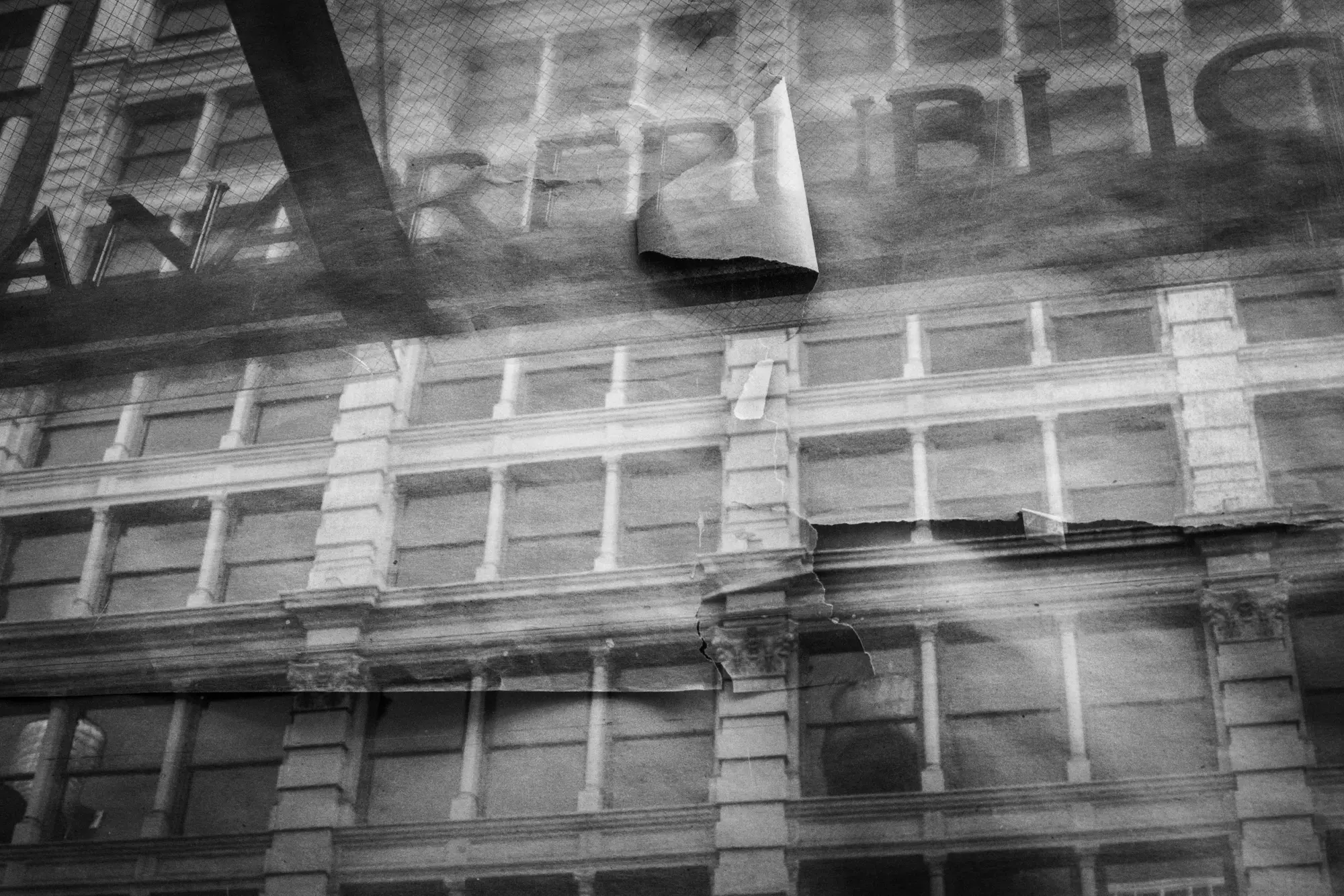 Reflections passing over a building facade